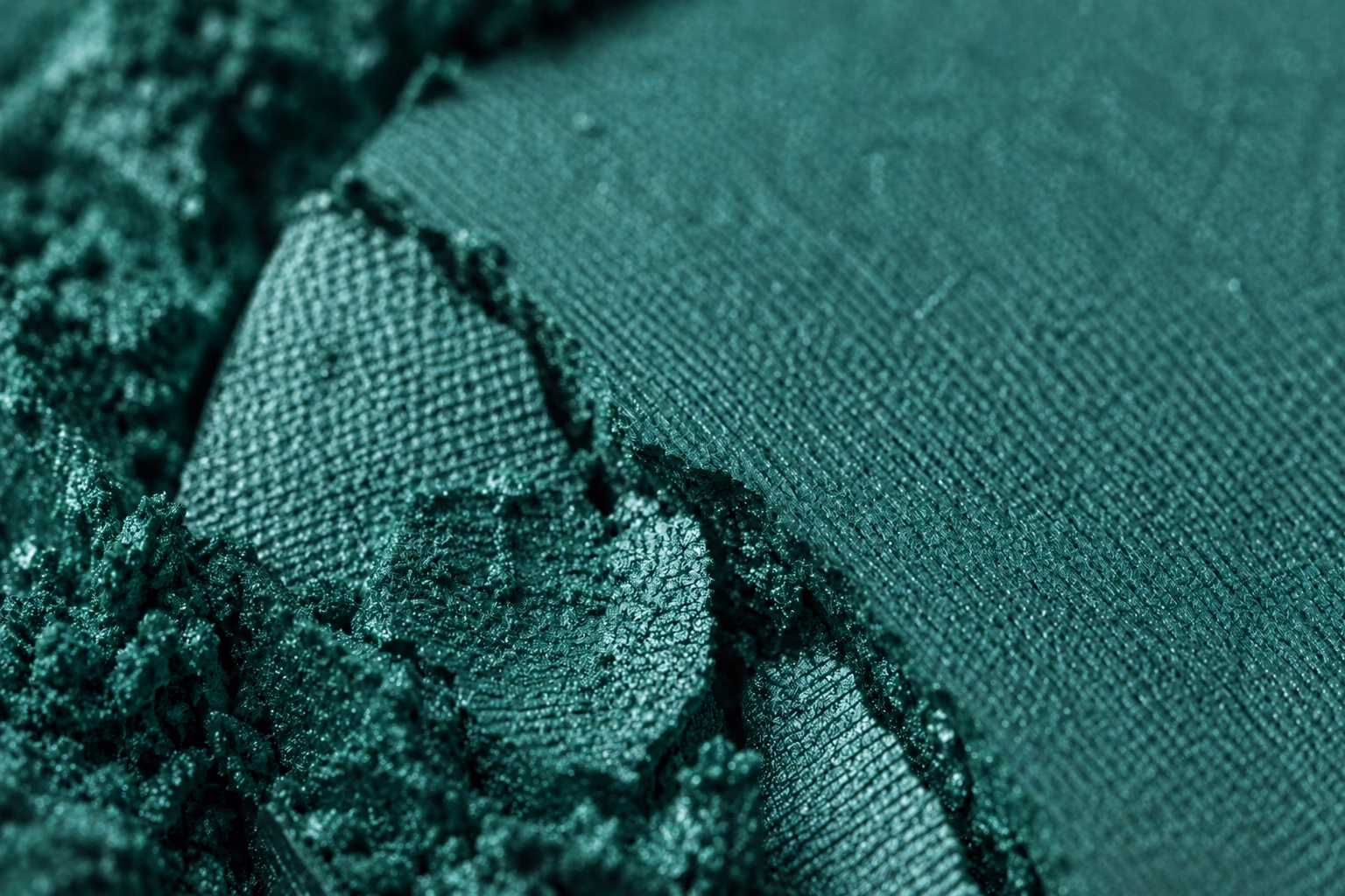 Close-up of a crushed emerald cosmetic texture.